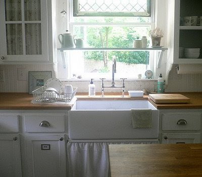 If you don't have enough shelf space, consider putting one above your sink, in front of the window, like this. Photo credit: www.nataliemack.blogspot.com